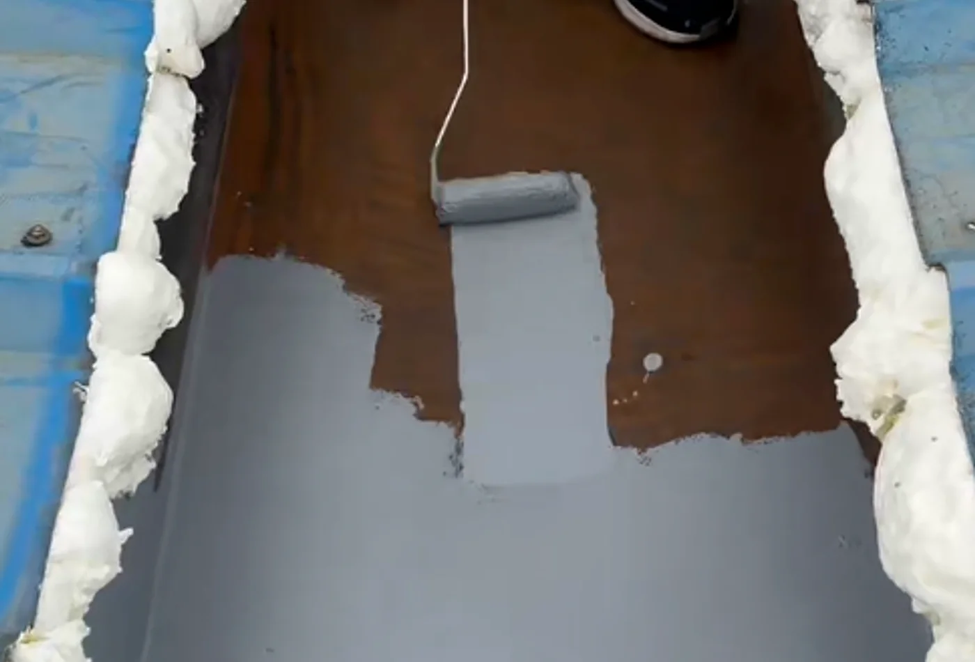 Real waterproof coating application on an industrial roof detail